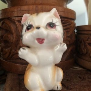 Adorable small ceramic kitten.
